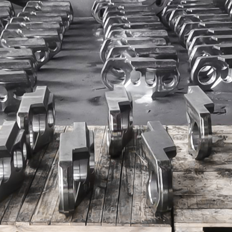 Kaivinkoneen telalenkkien takoot